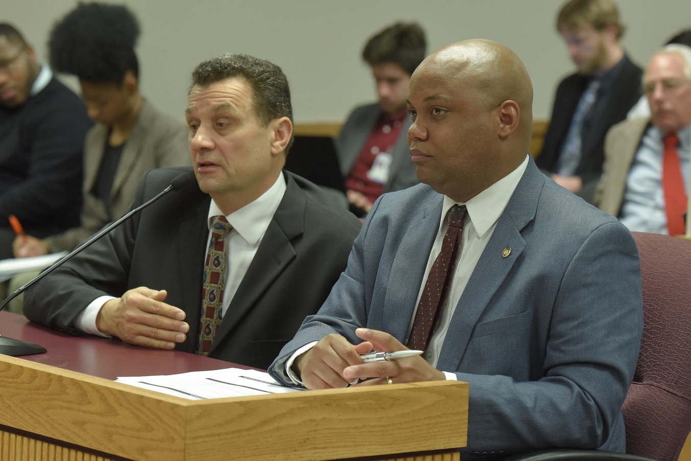Representative Shamed Dogan (right) listens as Michael Bell testifies in favor of a bill that would require independent investigations of all deaths involving law enforcement officers. Bell's son was fatally shot by police in Kenosha, WI, in 2004. Bell later won a lawsuit against police in that case. (photo; Tim Bommel, Missouri House Communications)